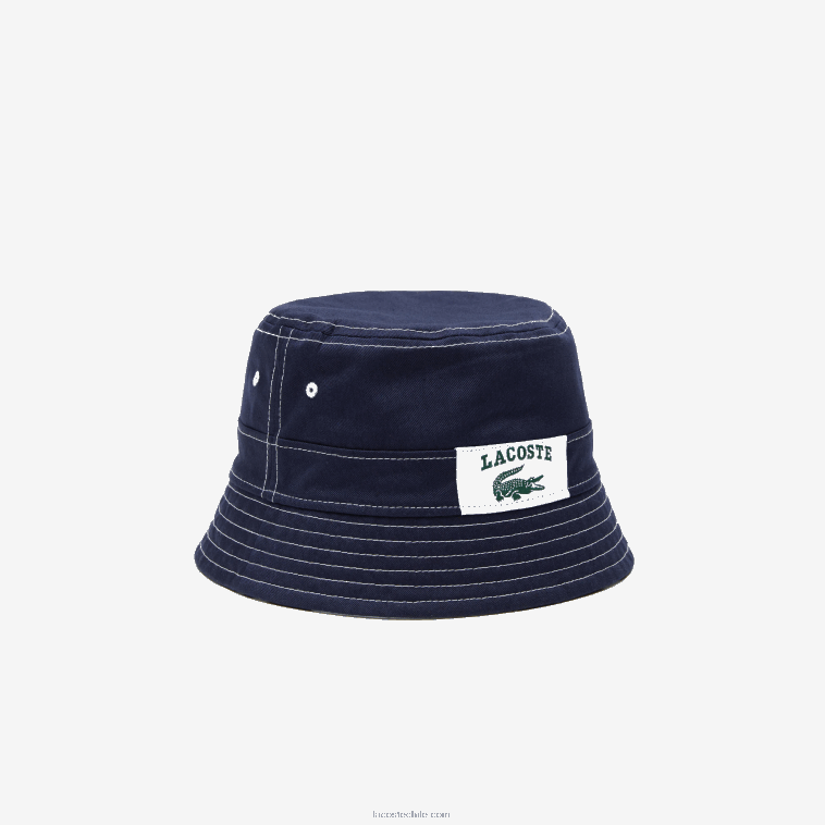 hombres Lacoste azul marino blanco 525 sombrero de pescador heritage de algodón liso o estampado reversible N6XZ22342