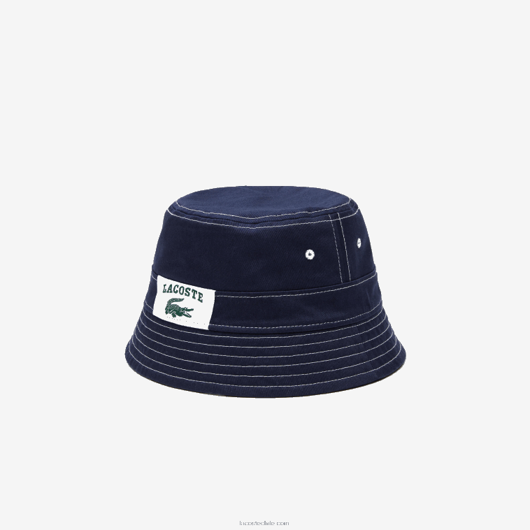 hombres Lacoste azul marino blanco 525 sombrero de pescador heritage de algodón liso o estampado reversible N6XZ22342