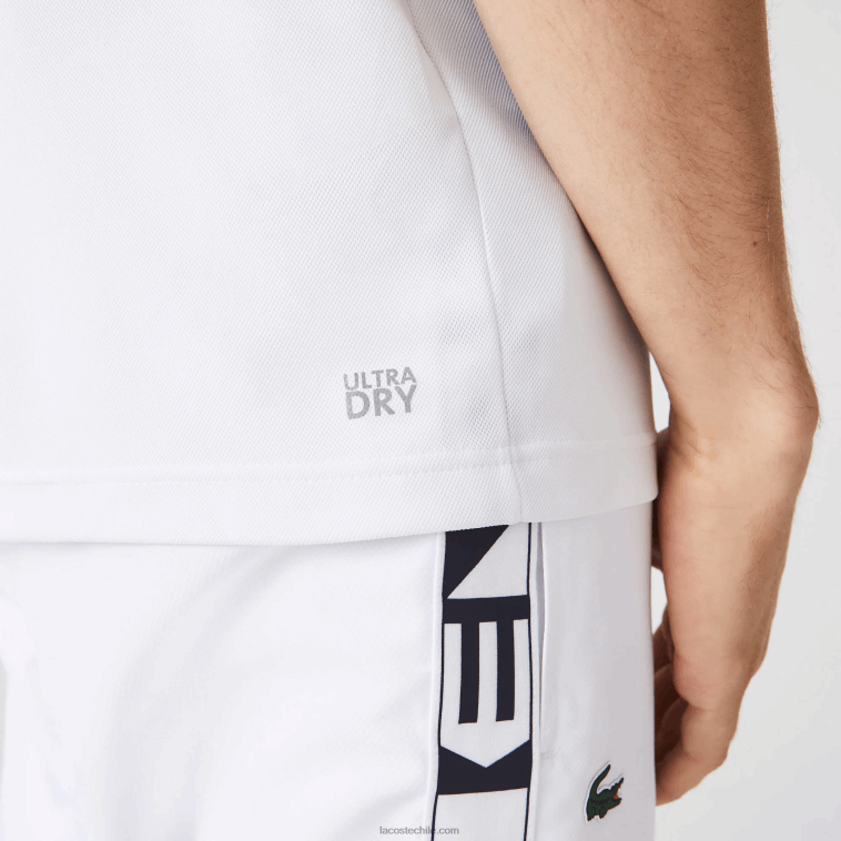 hombres Lacoste blanco azul marino 5yp Polo deportivo de tenis de piqué resistente a las carreras de ajuste regular N6XZ2556