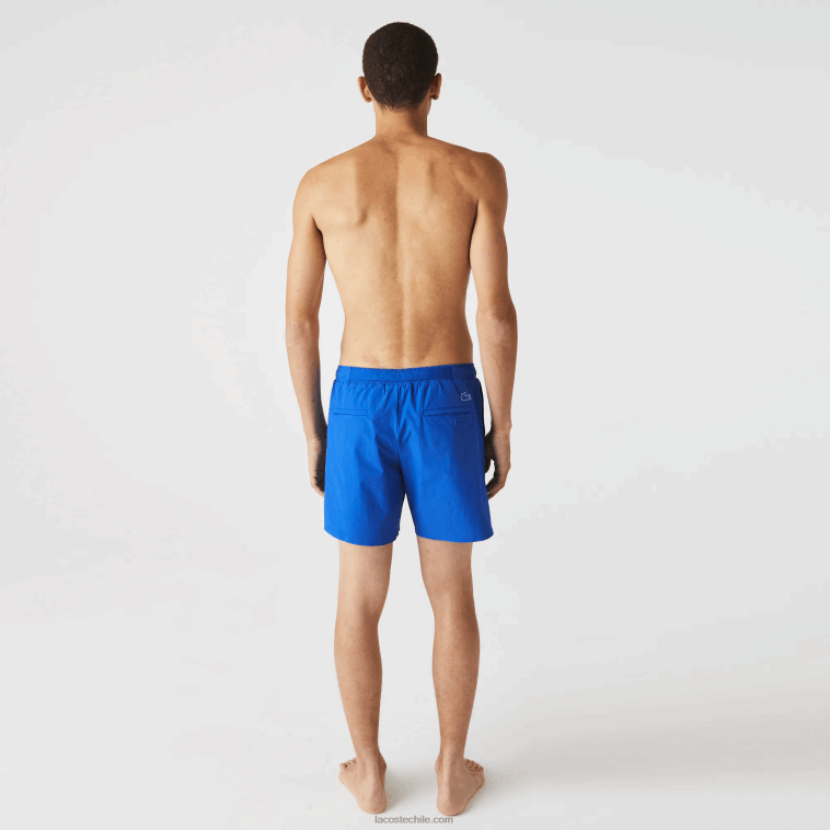hombres Lacoste azul blanco 7lc shorts de playa con estampado náutico N6XZ21661