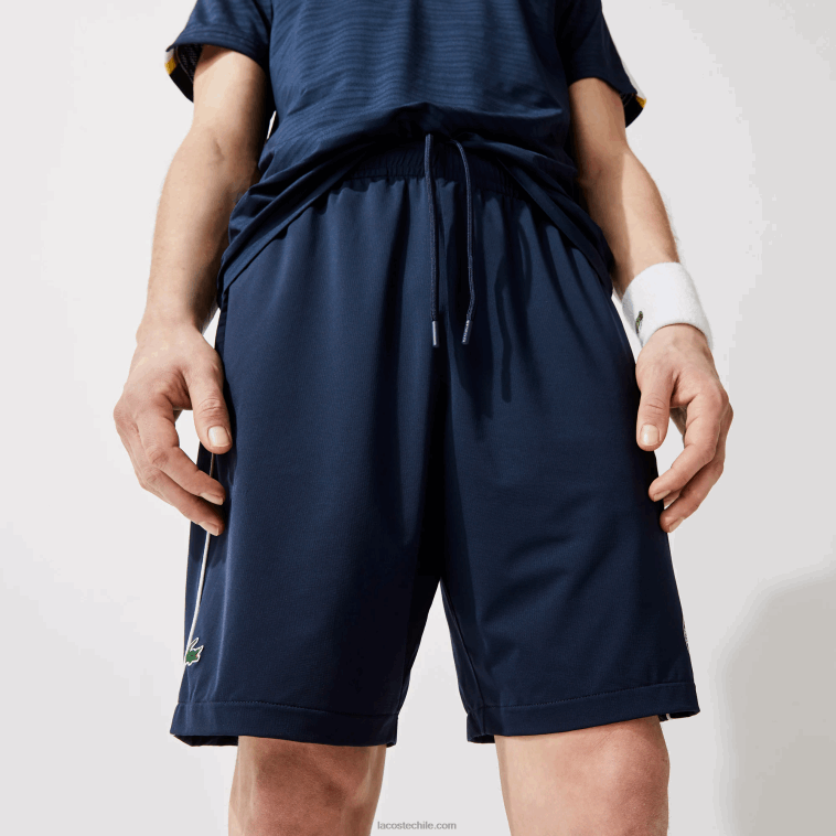 hombres Lacoste blanco azul marino r20 shorts deportivos ligeros y elásticos de edición abierta francesa N6XZ21546
