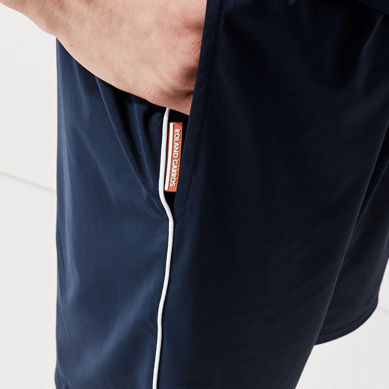 hombres Lacoste blanco azul marino r20 shorts deportivos ligeros y elásticos de edición abierta francesa N6XZ21546