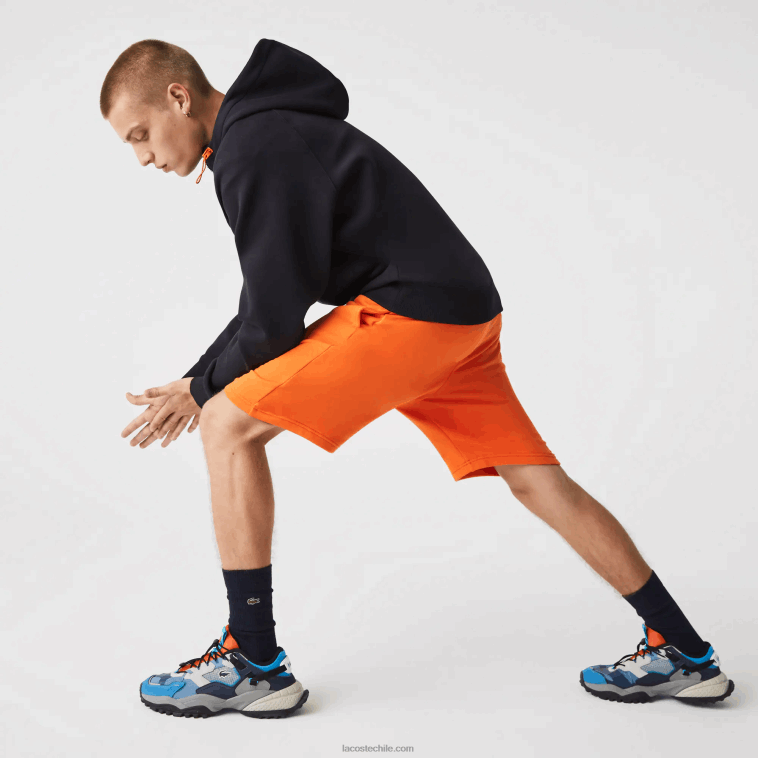 hombres Lacoste naranja tv1 pantalones cortos deportivos de tenis N6XZ21577