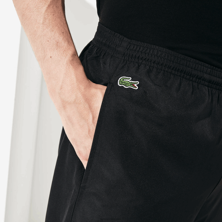 hombres Lacoste negro 031 pantalones de chándal sport tennis de tafetán con tejido de rombos N6XZ21113