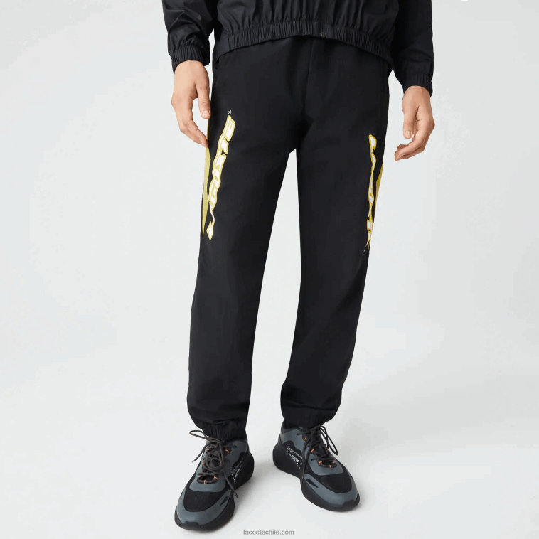 hombres Lacoste negro amarillo n07 pantalones de chándal heritage regular fit con bloques de color N6XZ21110