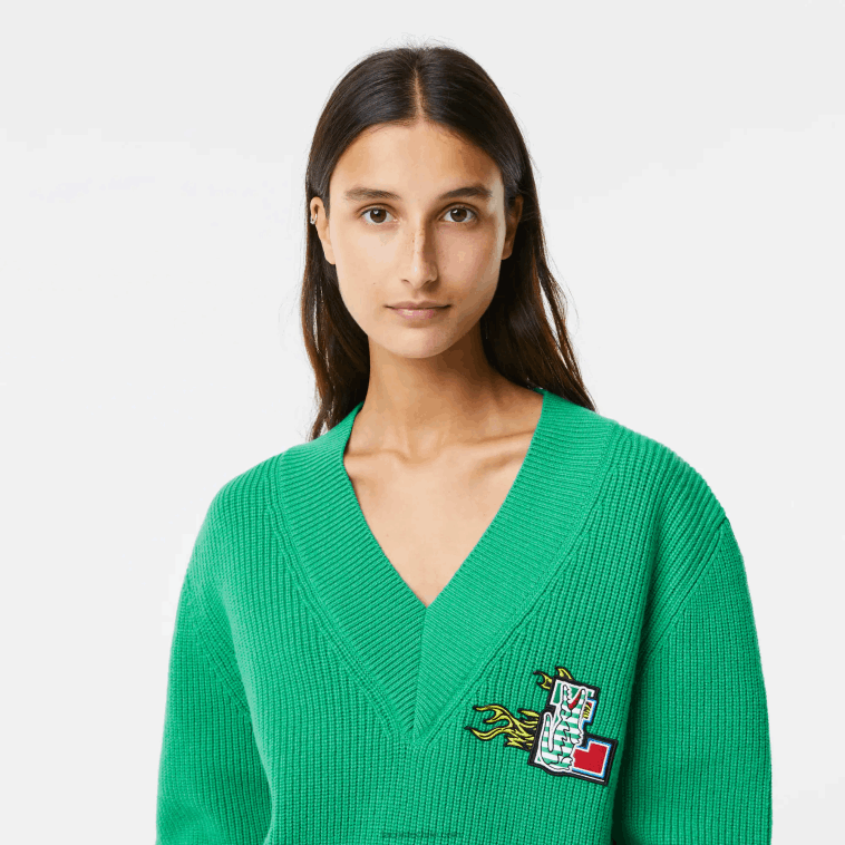 mujer Lacoste ldm verde jersey de lana con cuello de pico y placa de cómic N6XZ22643